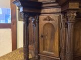 a large wooden grandfather clock on display in a room