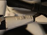 a close up of a star wars stormtrooper helmet and a pair of scissors
