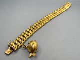 an image of a gold bracelet with a turtle on it