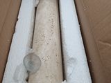 a box with a piece of wood inside of it
