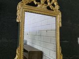 a mirror hanging on the wall in a room