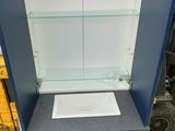a small cabinet with a sink inside of it