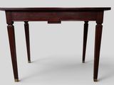 a small table with two legs and a wooden top