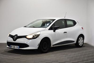 a white car is parked in a room with a checkered floor