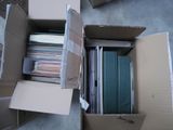 a lot of files in a box on the floor