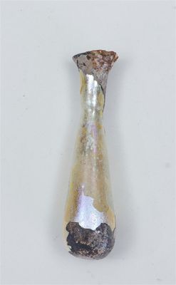 a glass vase with a rock in it sitting on a table