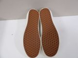 vans slip on shoes with white soles on a white surface