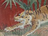 a painting of a tiger that is running in the grass