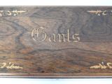 a close up of a wooden box with writing on it