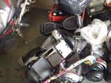 two motorcycles parked next to each other in a garage