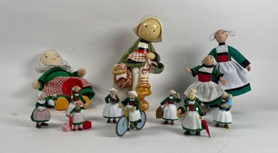 five figurines of people dressed in traditional clothing