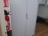 a fire extinguisher in the corner of a room