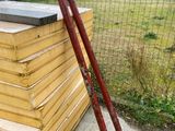 a pile of wood and a baseball bat on the ground