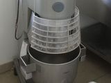 an image of a mixer in a kitchen with a window in the background