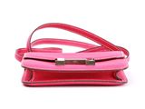a pink purse on a white background