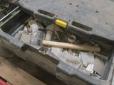 a tool box with tools in it sitting on a pallet