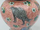 a vase with a leopard on it on a white background