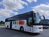 two buses that are parked in a parking lot