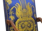 a blue and gold chair with a blue and gold pattern on it