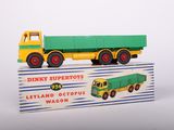 a green and yellow toy truck with a green trailer