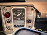 a close up of a car dashboard with a clock on it