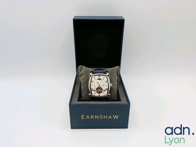 an image of a watch in a box on a white surface