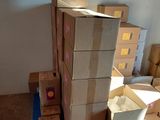 a stack of boxes sitting on top of a blue carton