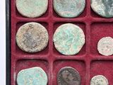 a picture of a box of ancient roman coins