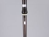 a black and white picture of a flute on a clear surface