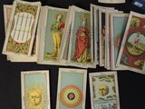 a lot of tarot cards that are on a table
