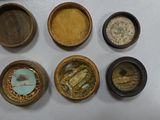 five small wooden containers that are sitting on a table