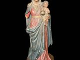 an image of a statue of a woman holding a child