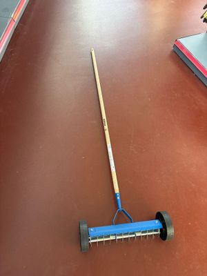a broom that is laying on the floor next to a broom