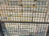 a cart full of newspapers sitting on the floor
