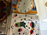 a clock on the counter in the kitchen with a snowman on it