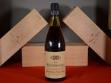 a bottle of wine that is sitting on a table