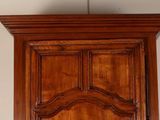an image of a wooden door with a clock on it