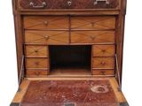 an old wooden desk with drawers and a drawer underneath it