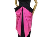 the mannequin is wearing a black and pink dress with a pink bow