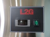 a picture of a close up of a button on a stainless steel refrigerator