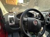 dashboard view of a car with a steering wheel and dashboard controls