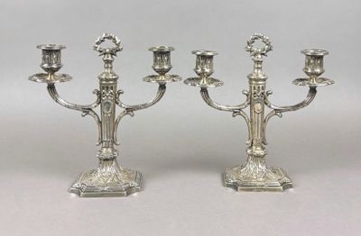 pair of silver plated candelabs with candlesticks on stands