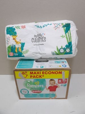 two boxes of diapers sitting on top of each other on a table
