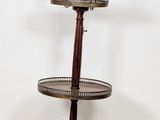 a lamp that is on a stand with a lamp on it