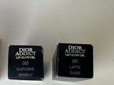 three boxes of dior addict lipstick sitting on a white surface