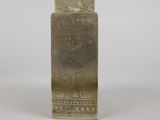 an image of a silver vase with a design on it