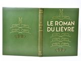 an old book with a green cover and gold lettering on it