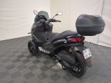 a motorcycle that is parked on the floor in a room