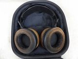 a pair of headphones in a case on a white surface