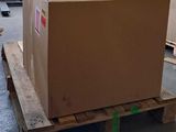 a large cardboard box on a pallet in a warehouse